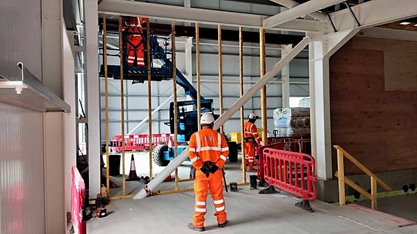 Setting out full-height partition framing in a steel-framed building