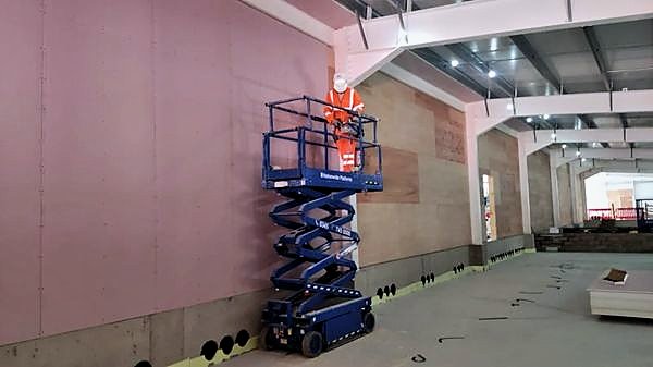 Boarding a high wall from a scissor lift