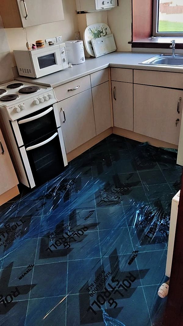 Kitchen with floor protection laid before refurbishment works