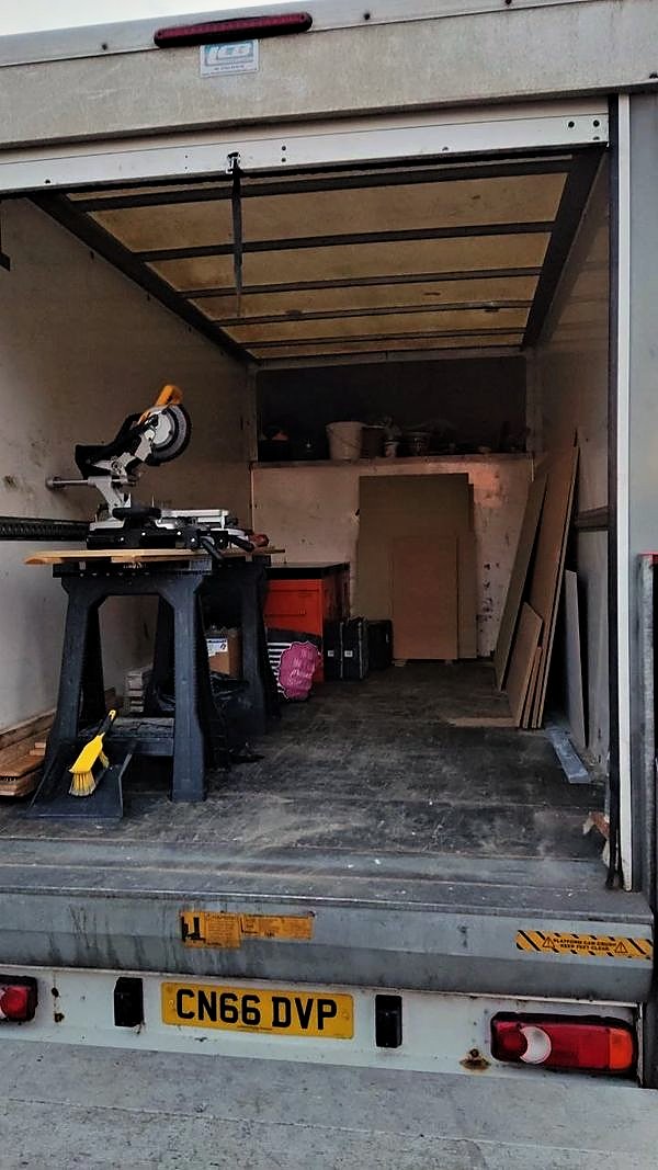 Site van loaded with a saw bench and materials for residential works