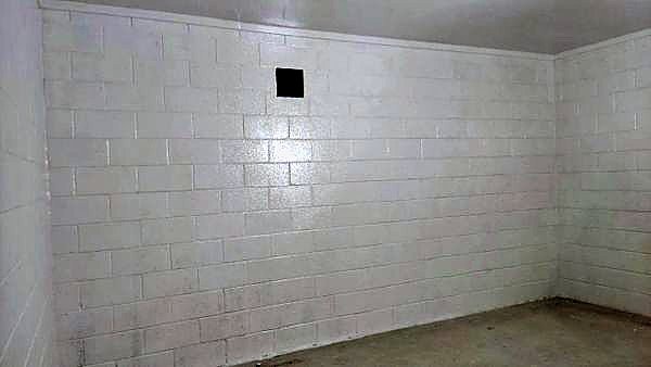 Blockwork walls sealed with a white protective coating