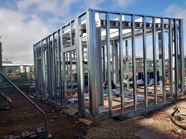 Light-gauge steel frame of a new building before boarding