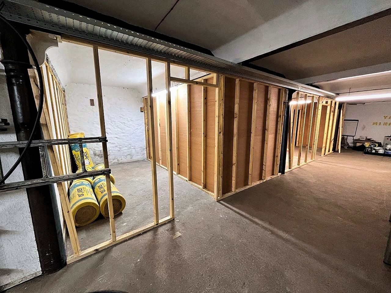 New timber stud partitions and insulation inside the old distillery building
